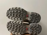 the soles of a pair of hiking shoes on a cardboard box