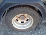 a flat tire on the side of a truck