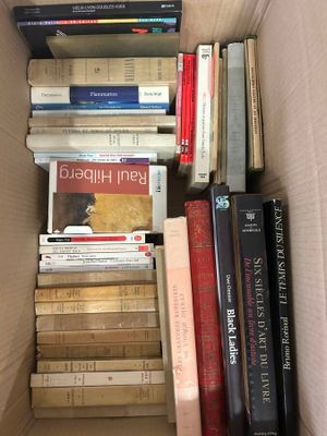 a box full of books that are stacked on top of each other