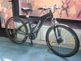 a bicycle that is parked in front of a window