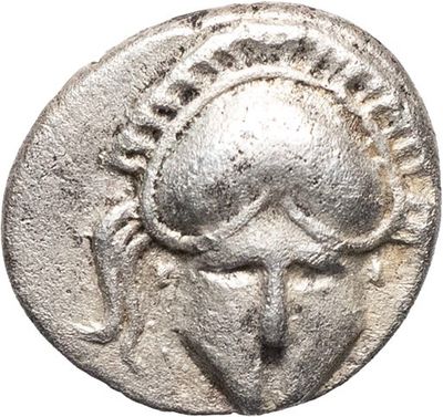 a silver coin with a woman ' s face on it