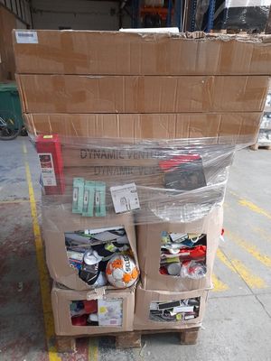 a cart with many boxes on top of it in a parking lot
