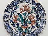 a plate with a flower design on it on a table