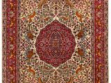 a red and white rug with a medallion design on it