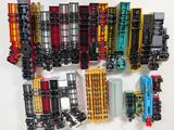 a lot of toy trains that are on the table