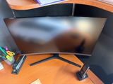 an image of a computer desk with a monitor on it