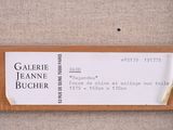 a label on the back of a piece of wood