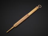 an old wooden umbrella with a metal handle on a black background