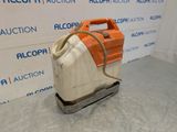 an image of an orange and white machine on a pallet
