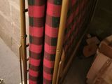 a picture of a wooden table with a red and black blanket on it