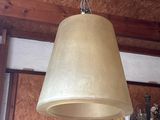 a lamp that is hanging from the ceiling in a room