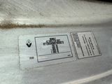 a close up of a metal object with a label on it