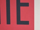 a red and black sign with the word life written on it