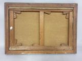 an old wooden frame with a picture hanging on the wall