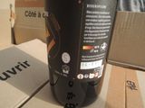 a bottle of wine sitting on a table next to a box