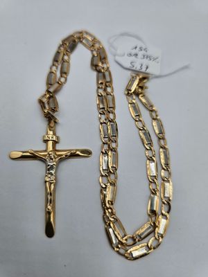 a gold chain with a cross on it and a gold chain with a cross on it