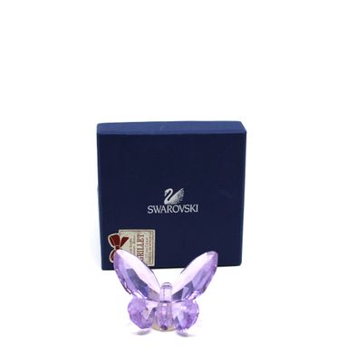 figurine de papillon violet dans un coffret cadeau avec une boîte bleue