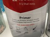 two cans of kramp primer paint on a counter