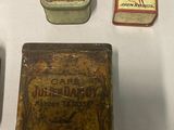 many different types of tins on display on a table