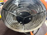 a close up view of a stove with a fan on it