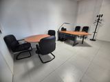 an image of a conference room with a table and chairs