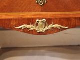 a wooden table with a clock on top of it