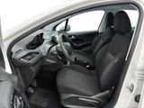the interior of a white car with black seats and a steering wheel