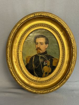 portrait of a man in a military uniform in a gold frame
