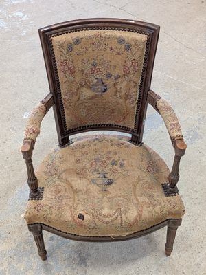 a chair that is sitting on the floor in the room