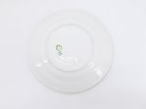 a white plate with a green design on it