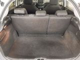 a trunk of a car with the back seats folded down