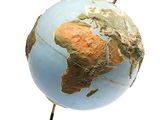 a small blue and gold globe on a stand