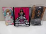 three barbie dolls are lined up in plastic bags on a table