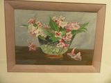 a painting of pink flowers in a glass bowl on a table