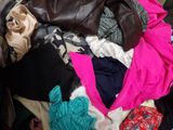 a pile of clothes that is sitting in a suitcase