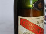 a close up of a bottle of wine on a table