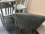 three chairs sitting next to each other in a room