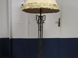 a lamp that is on a stand in a room