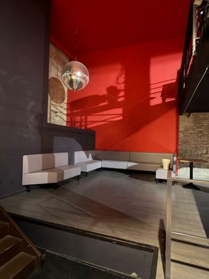 an image of a living room with a couch and stairs
