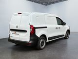the rear of a white van is parked in a large room