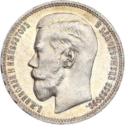 Gros plan sur une pièce de monnaie portant le visage d'un homme
