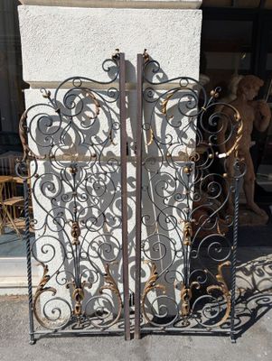 a large iron gate that is outside of a building