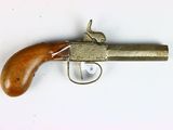 a toy gun with a wooden handle on a white surface
