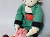 a stuffed toy that is sitting next to a stuffed toy