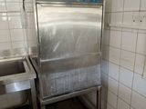 an image of a kitchen with a sink and a metal cabinet