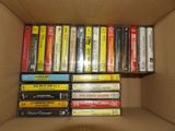 a lot of cassettes in a cardboard box