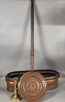 an image of a brass clock and a pair of brass candles on a table