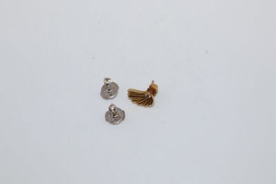 a close up of two screws on a white surface