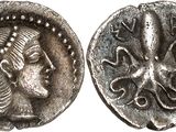 a silver coin with a woman ' s face on it