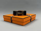 an orange box with a belt on top of it